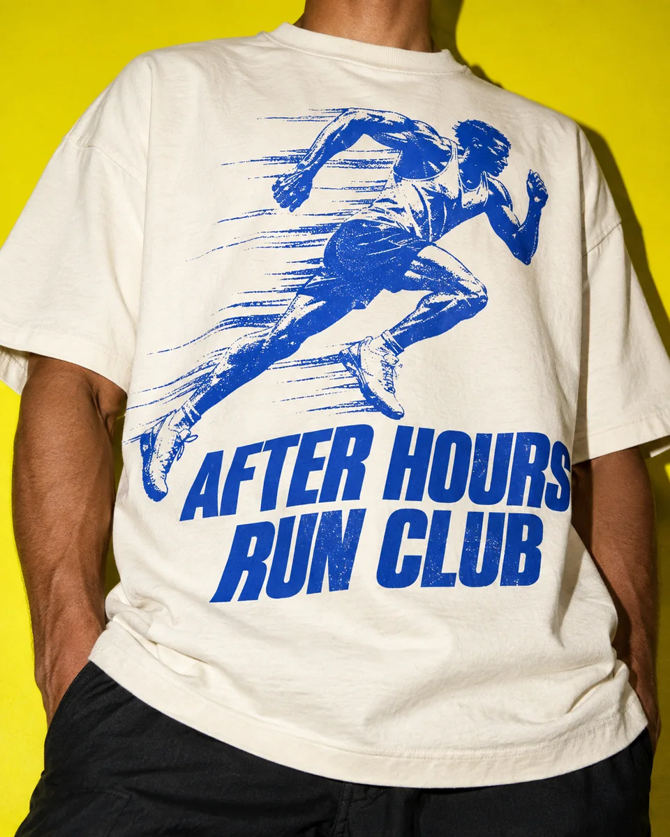 A cream After Hours Run Club graphic T-shirt against acid yellow